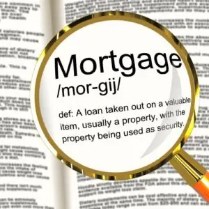 A magnifying glass examining different Mortgage Types in a book.