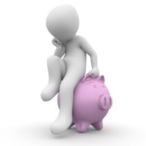 3D figure sitting pensively on a pink piggy bank, one foot on the ground and hand on chin, contemplating how to save money.