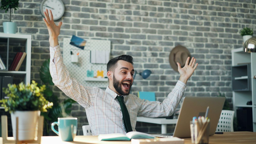 How to Use Your Raise to Pay Off Debt Faster 1 Excited employee planning to use your raise to pay off debt
