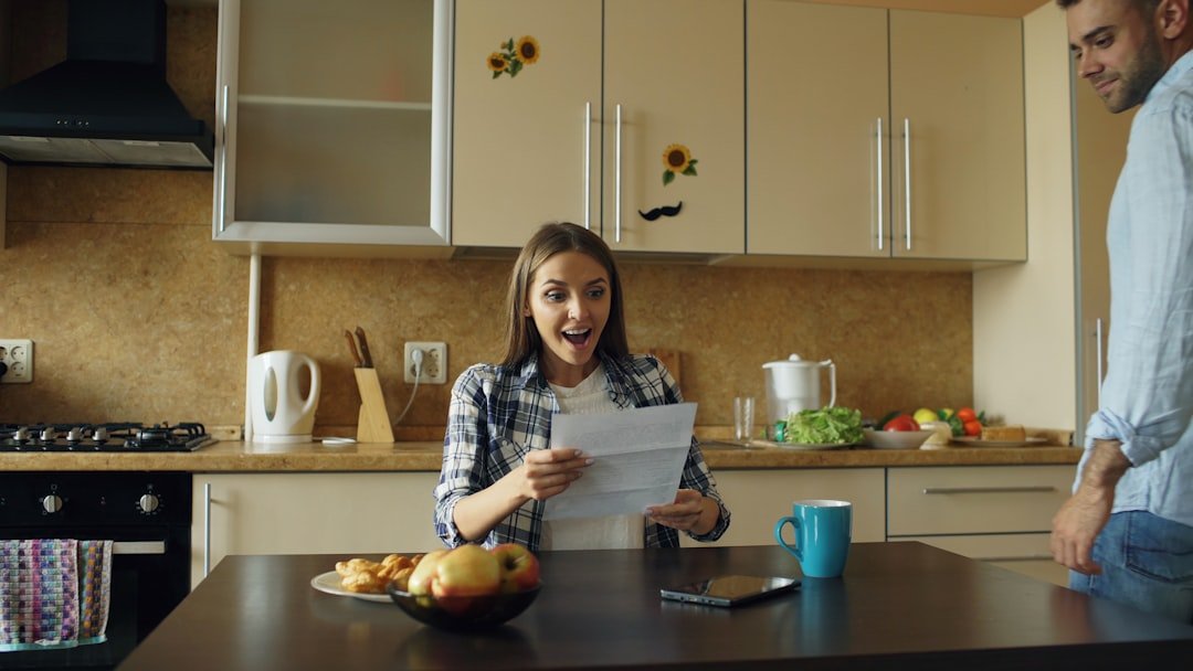 Couple having a calm conversation about money communication in relationships at home