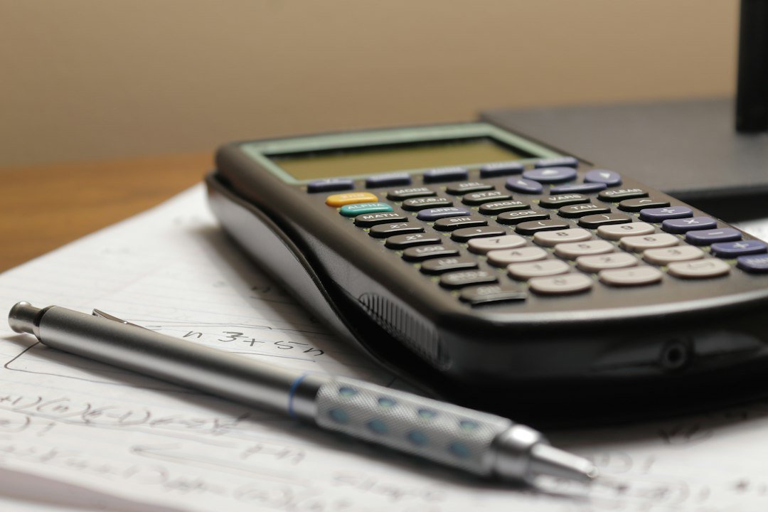 Negotiate a Medical Bill: calculator and paperwork on a desk